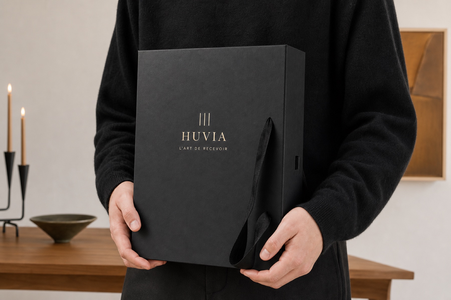 Person holding the closed foldable wine presentation box to show its scale